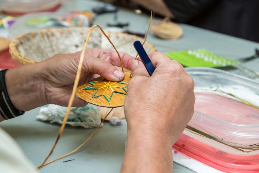 Close-up of hands doing quill work, Lennox Island, PEI